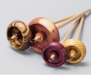 Four sizes of handcrafted wooden drop spindles for spinning