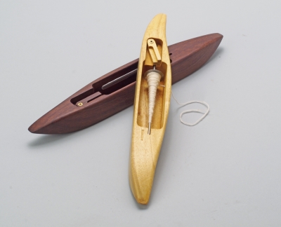 Two wooden boat shuttles for spinning