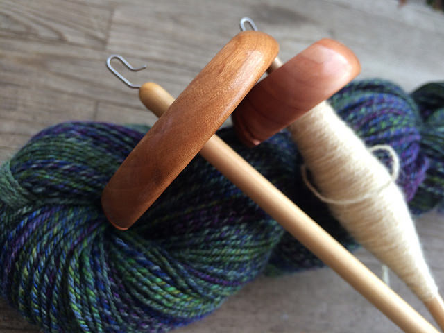 Two Bosworth Spindles on skein of blue and green wool